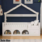 White Twin house bed with roof frame, guardrails and front storage cubbies against a blue bedroom wall