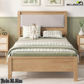 Front view of the natural finish Twin XL bed with a light upholstered headboard