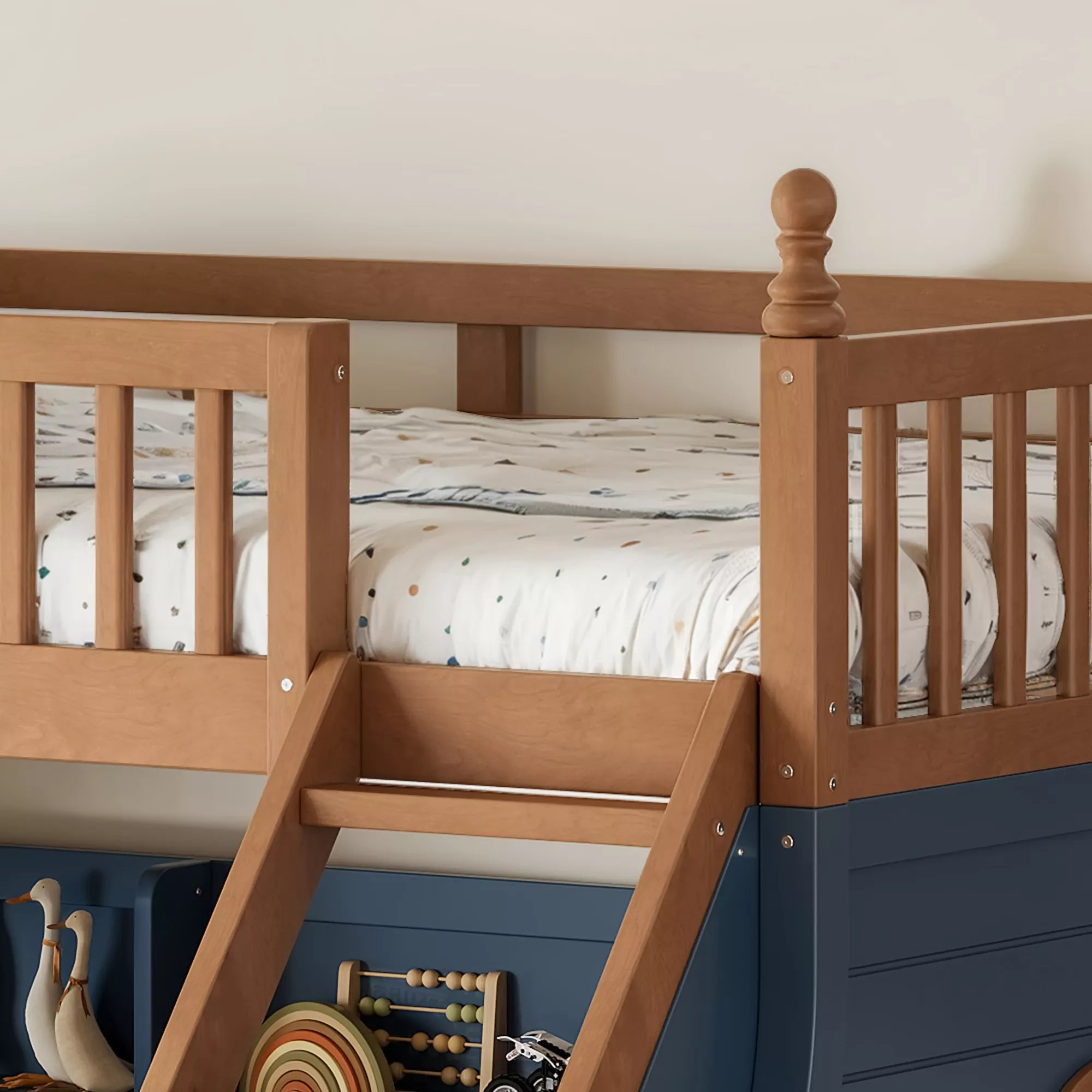 Close-up of wooden upper bunk guardrails and staircase beside the navy side panel