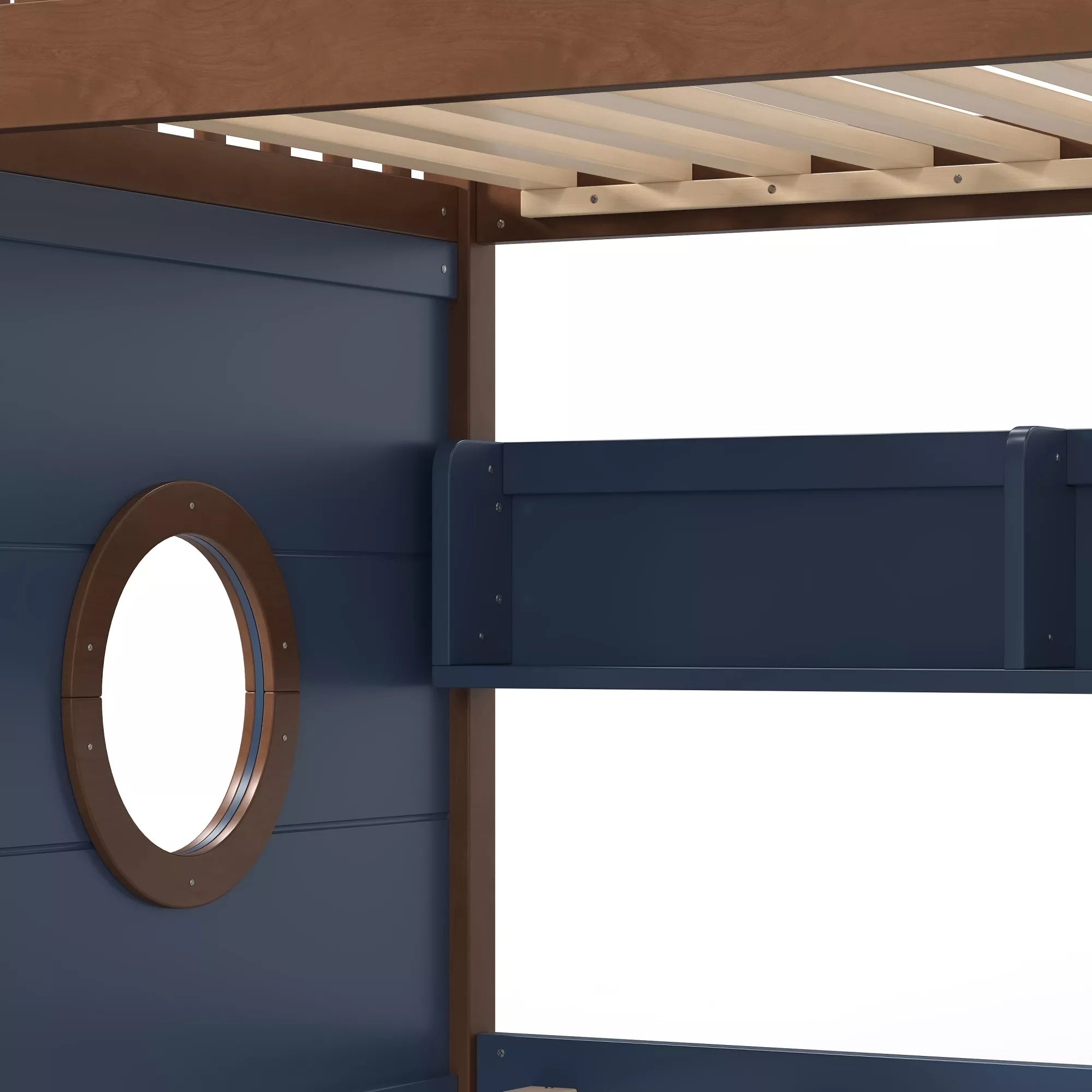 Close-up of the round porthole window on the wooden bunk bed side panel