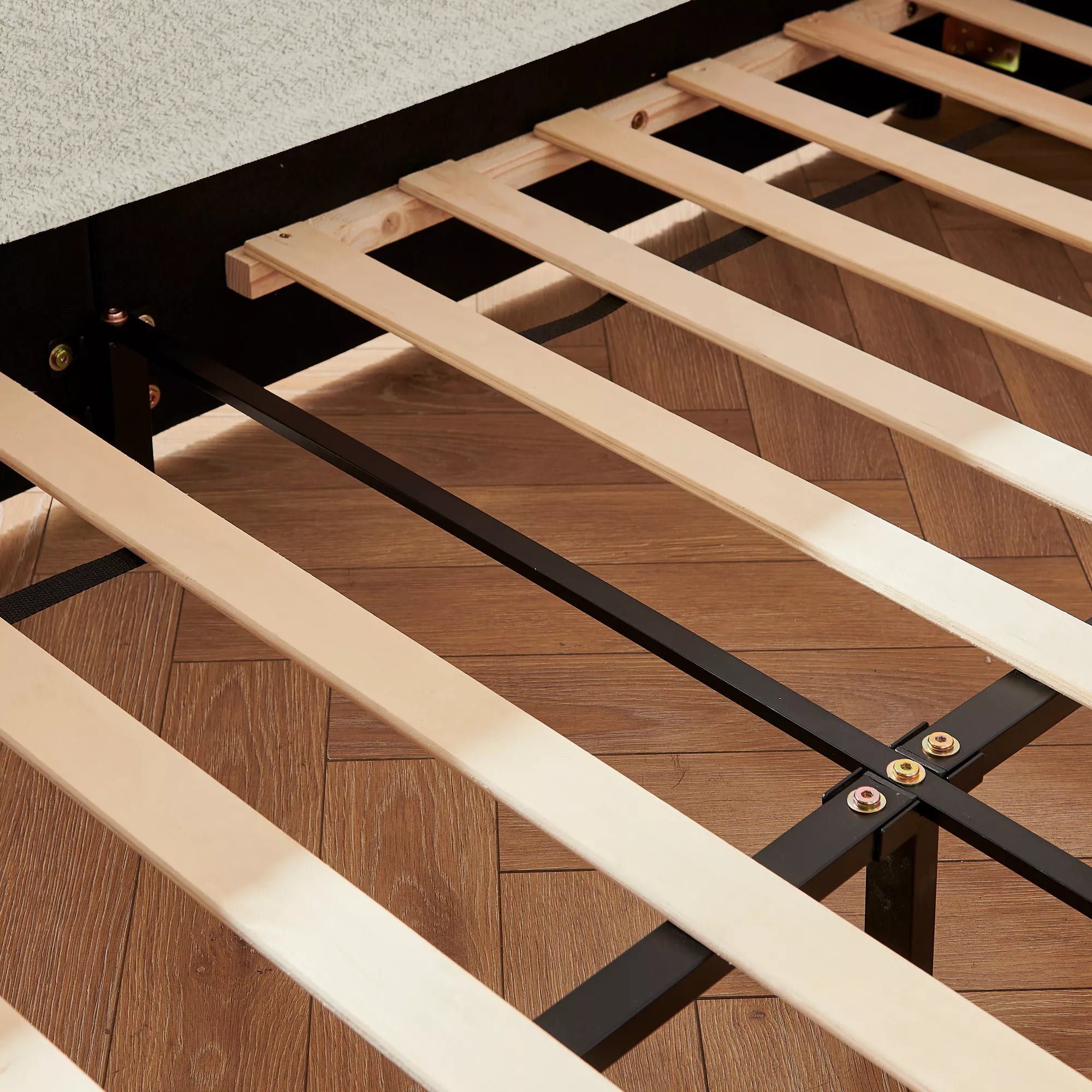 Solid wood slats and metal support frame for full size boucle kids platform bed, sturdy bed base close‑up