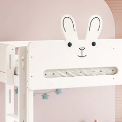 Close-up of the rabbit face and ear details on the white bunk bed headboard
