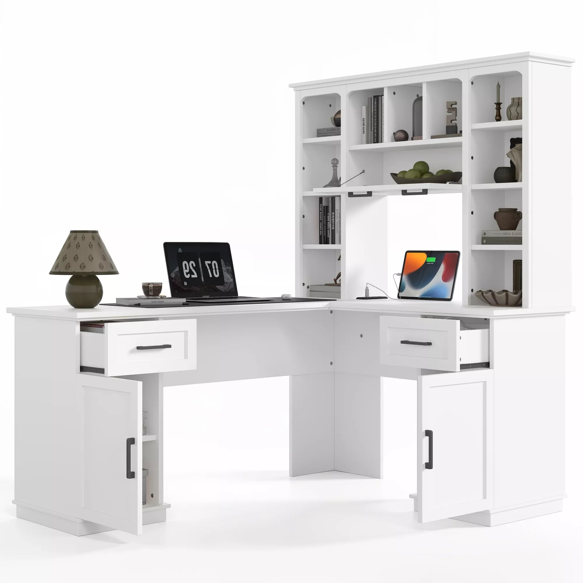 White L-shaped computer desk with storage hutch styled with a laptop and desk accessories