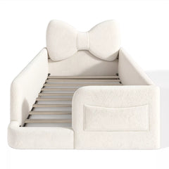 kids platform bed with upholstered side rails and storage pockets