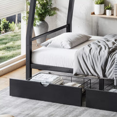 Close-up of the lower bed and an open storage drawer containing bedding items