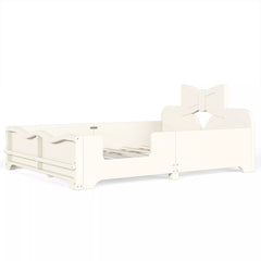Angled view empty white kids bed frame with bow headboard, safety rails and footboard bookshelf