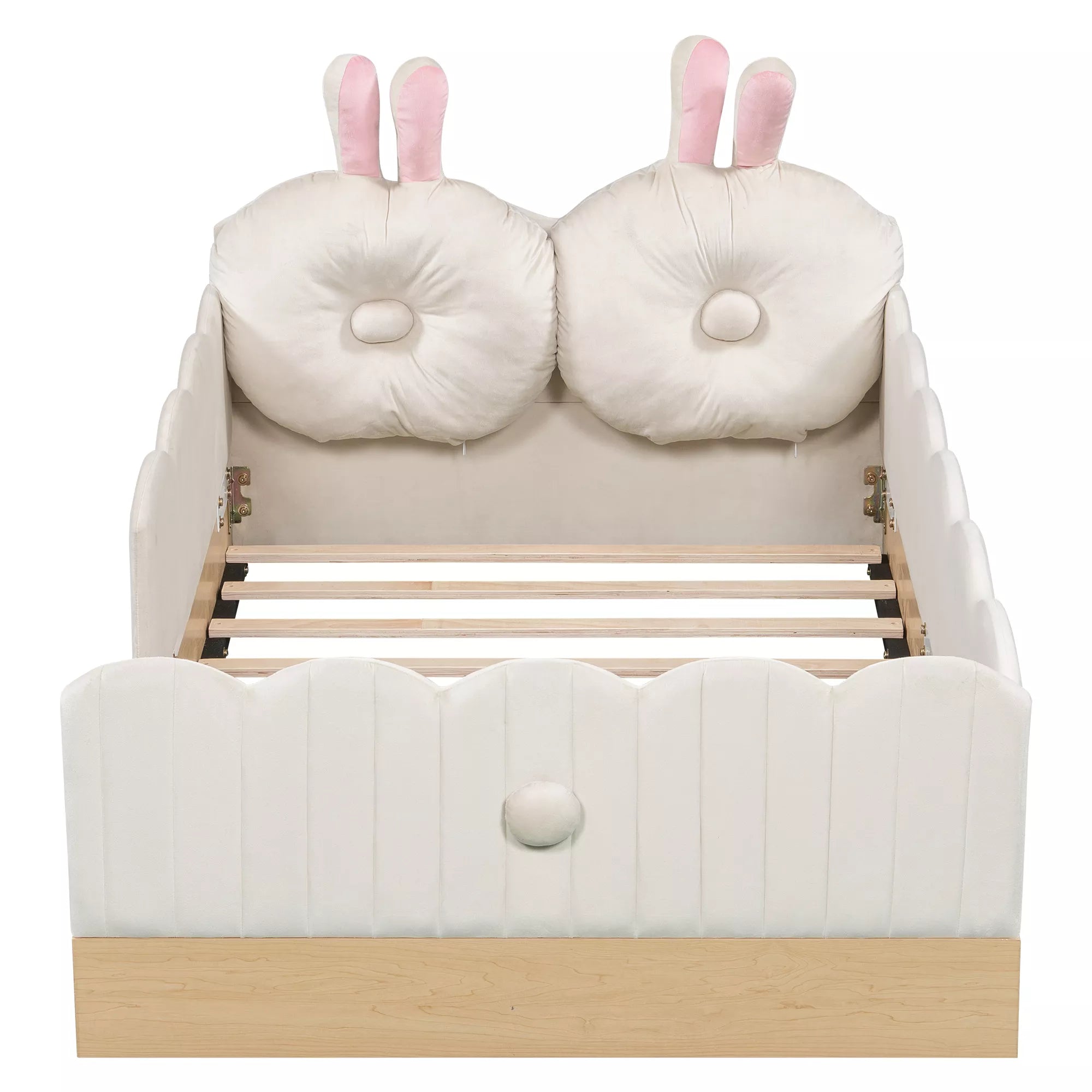 Front view of white twin upholstered bed with bunny pillows and scalloped panels