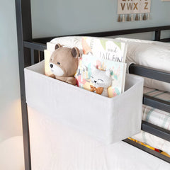 Hanging storage bag on kids loft bed guardrail for small items