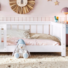White Montessori floor bed with built-in bookshelf for kids bedroom