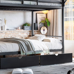 Close-up of lower bunk sleeping area and fabric storage drawer on a black metal bunk bed