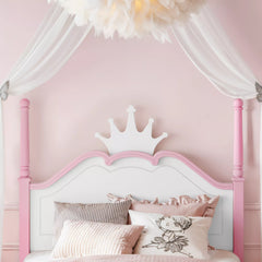 White platform bed with crown headboard in bedroom setting