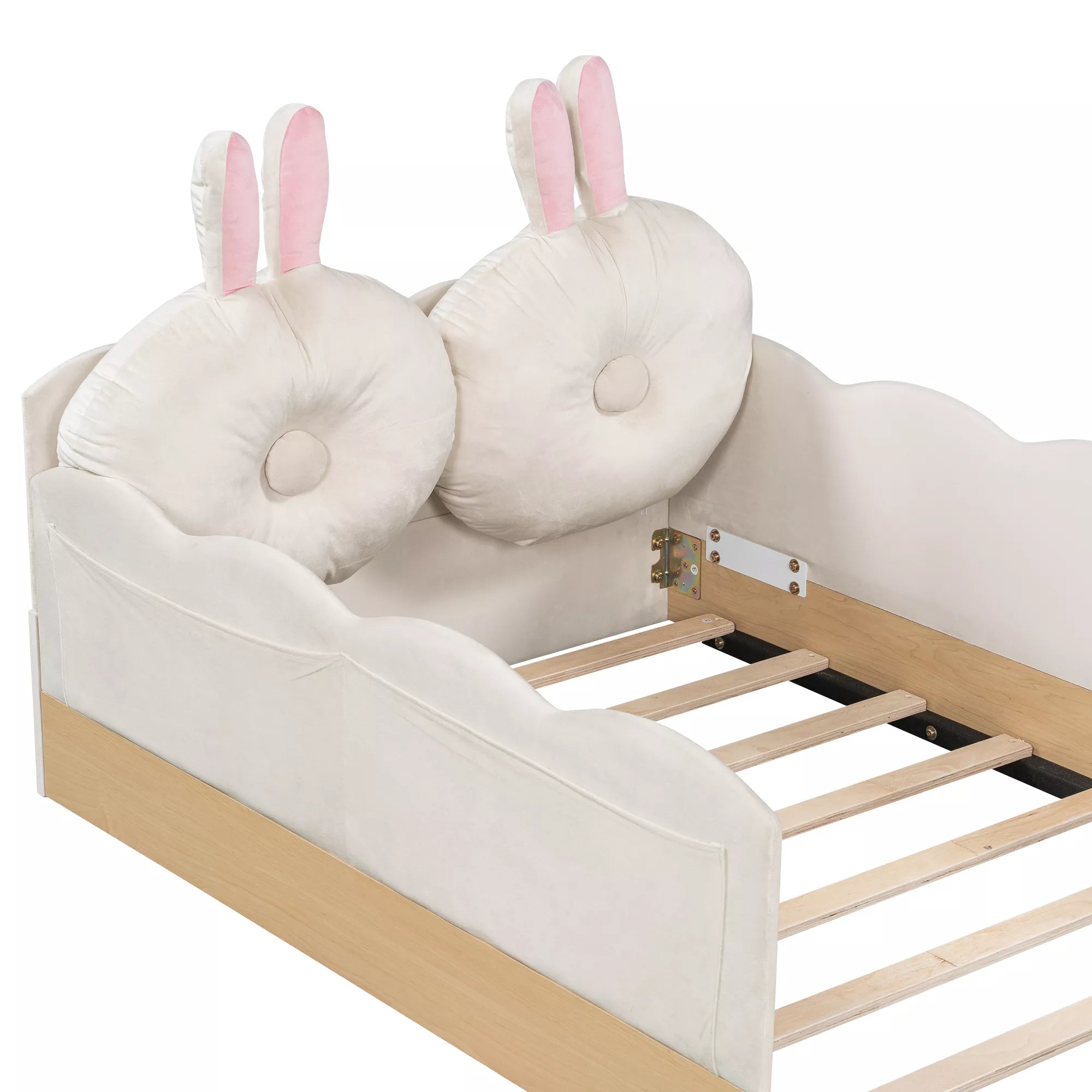 White twin upholstered platform bed with bunny ear pillows and wooden slats