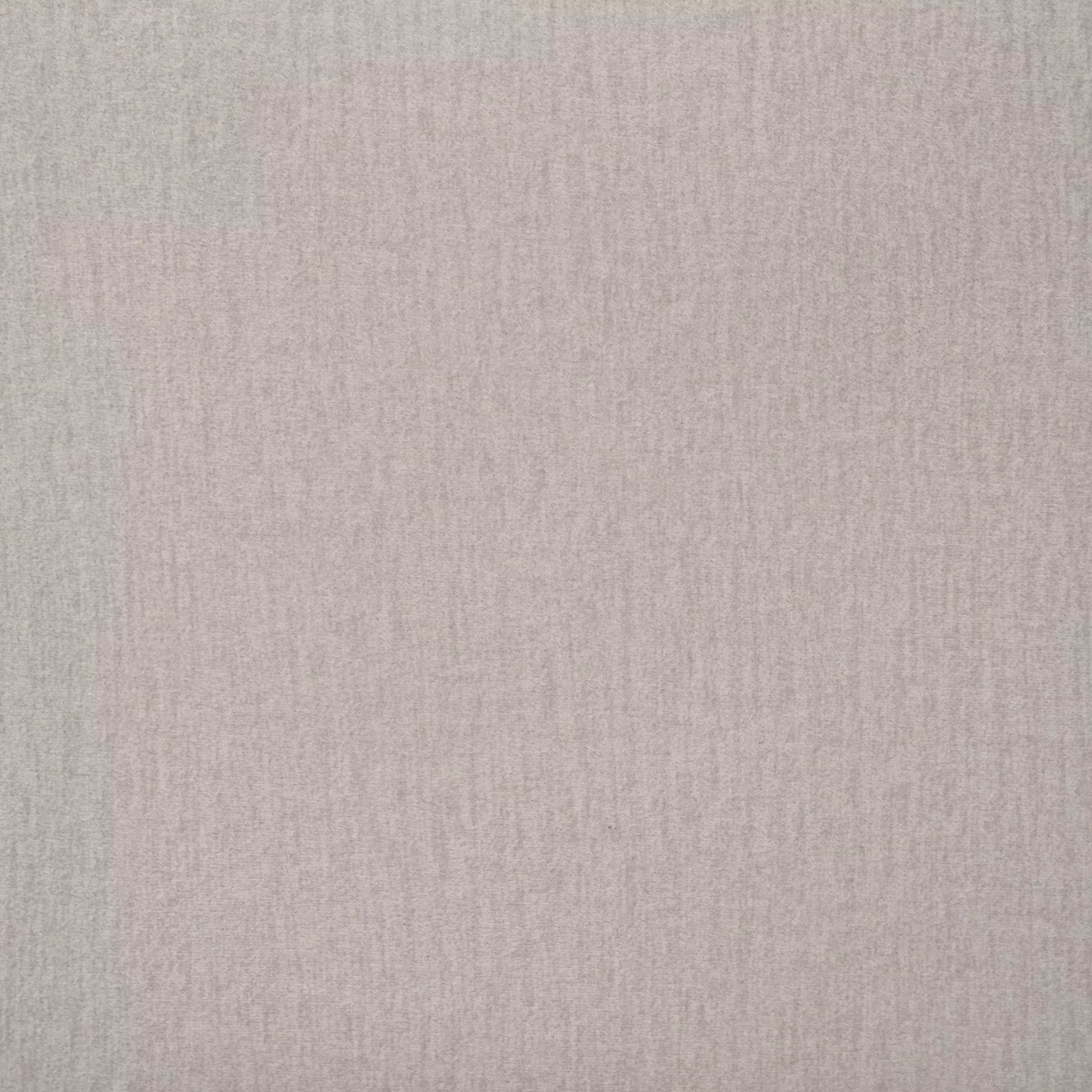 Close-up of the light neutral upholstery fabric on the headboard
