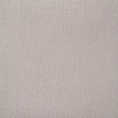 Close-up of the light neutral upholstery fabric on the headboard