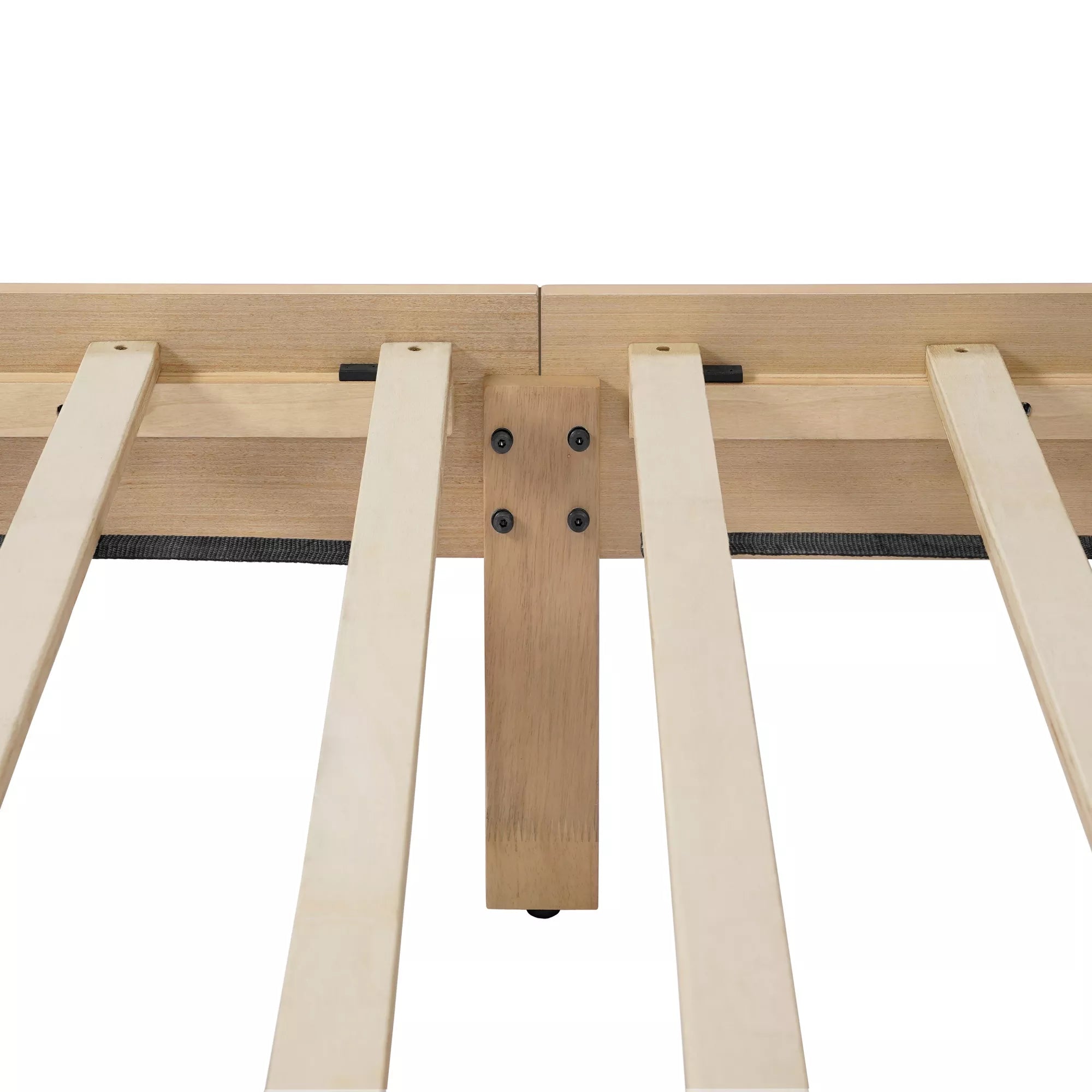 Underside of the wooden bed frame showing the slat support area and central support