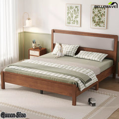 Brown Queen bed with upholstered headboard in a bedroom, three-quarter view