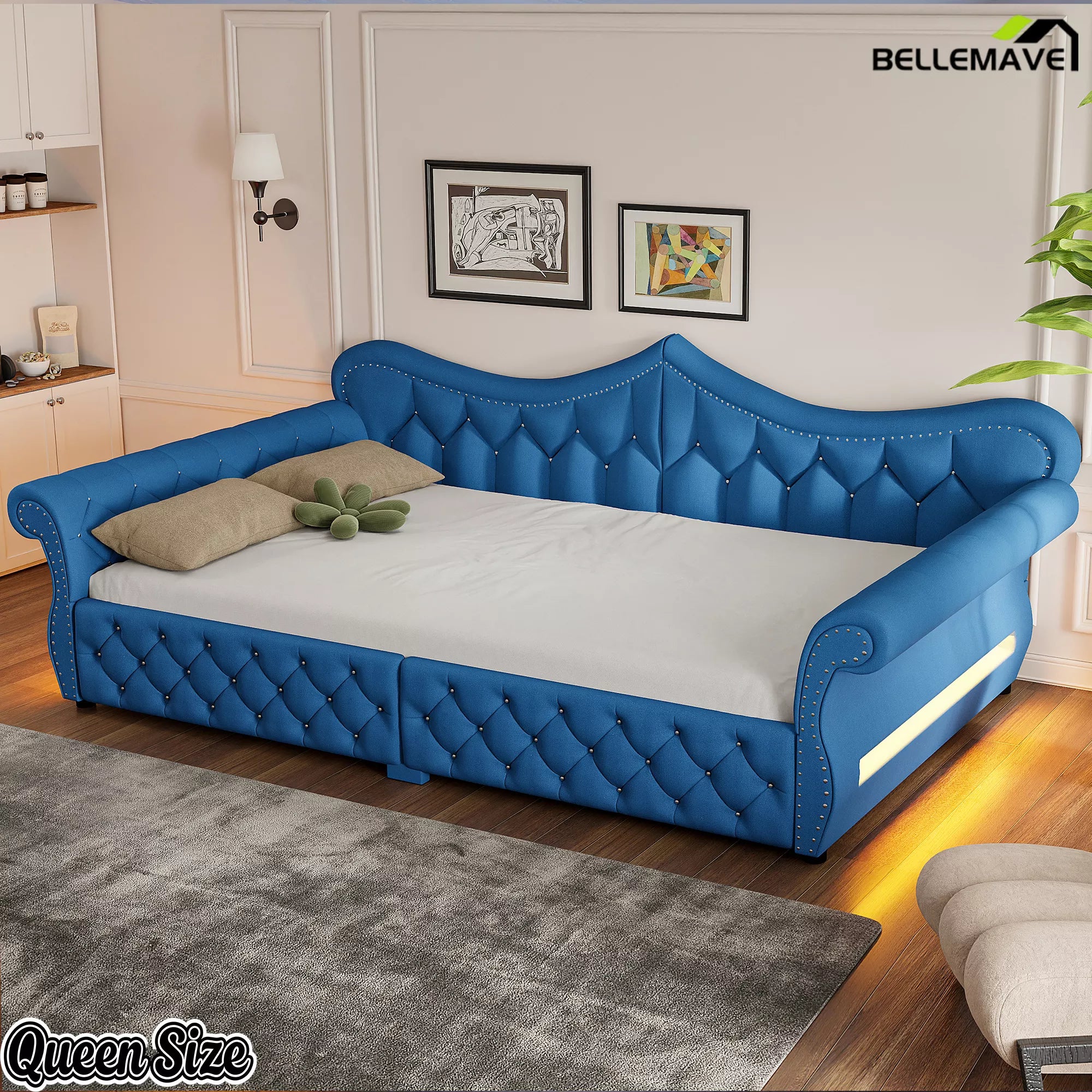 Blue upholstered queen daybed with diamond tufting and rolled arms