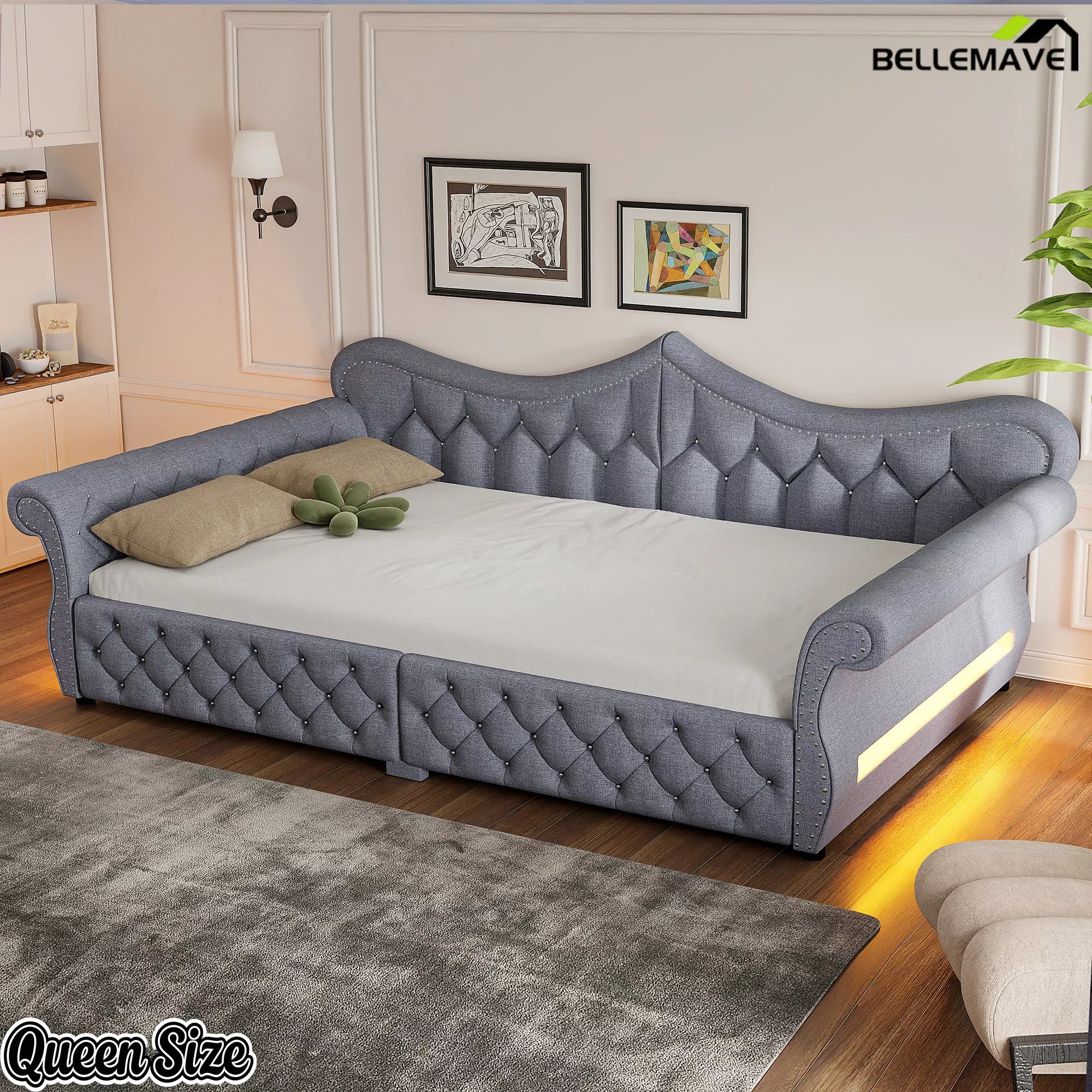 Gray upholstered queen daybed with diamond tufting and rolled arms
