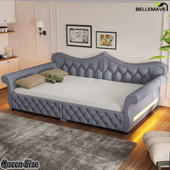 Gray upholstered queen daybed with diamond tufting and rolled arms