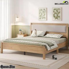 Natural wood Queen bed with upholstered headboard in a bedroom setting