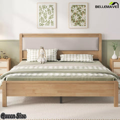 Front view of the natural finish Queen bed with a light upholstered headboard