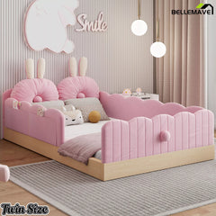 Pink bunny-themed upholstered bed styled with pillows in a bedroom