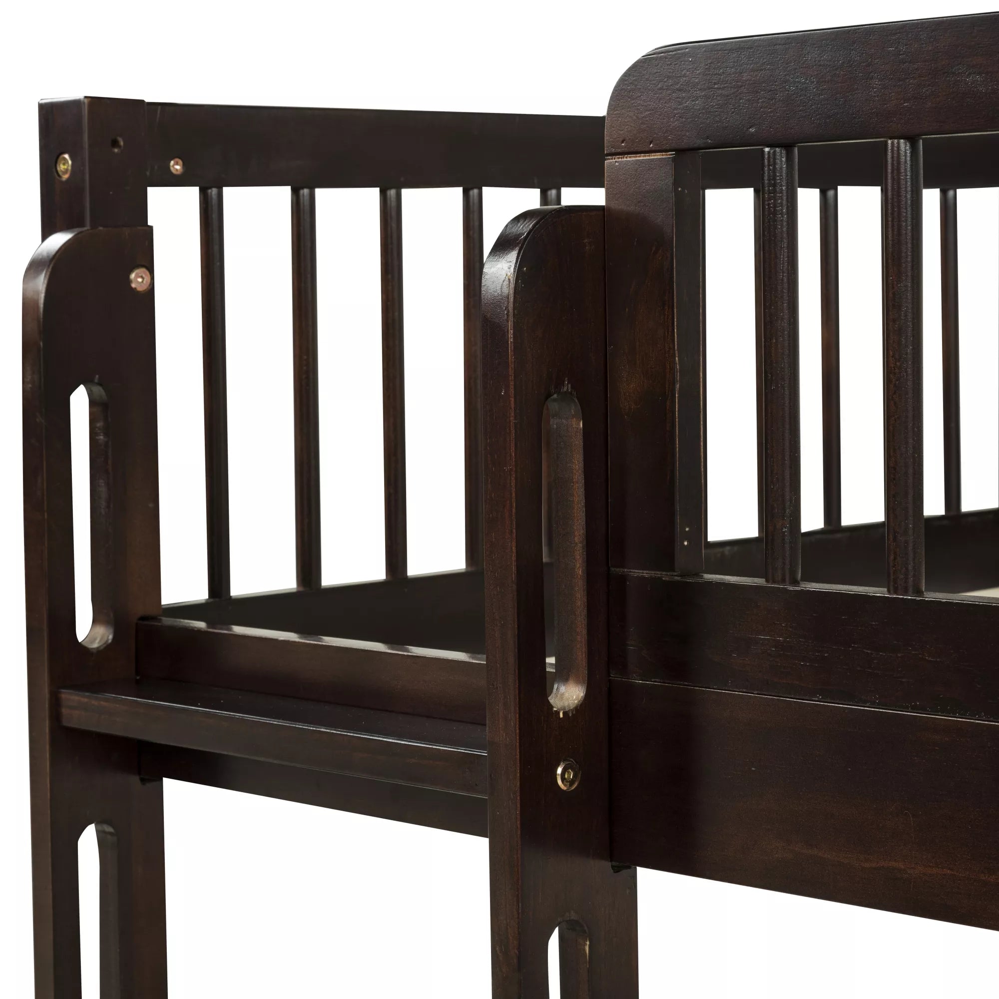 Close-up of the wooden upper bunk guardrail and corner post