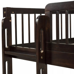 Close-up of the wooden upper bunk guardrail and corner post