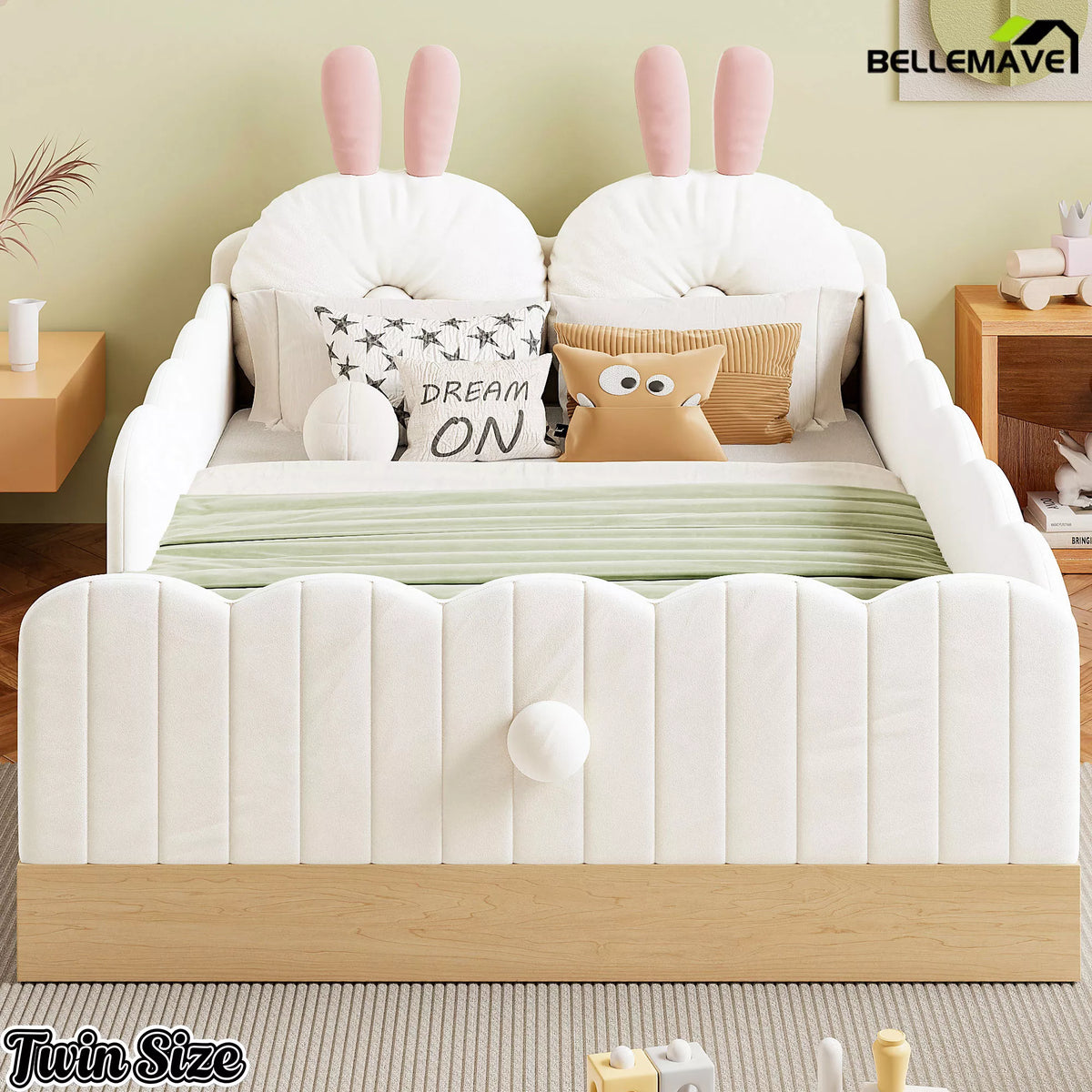 Front view of white twin upholstered bed with bunny pillows and wood-look base