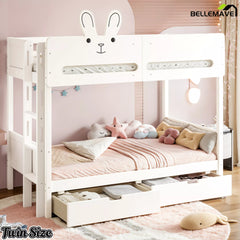 Twin-size white kids bunk bed with rabbit headboard and bottom storage drawers, angled view