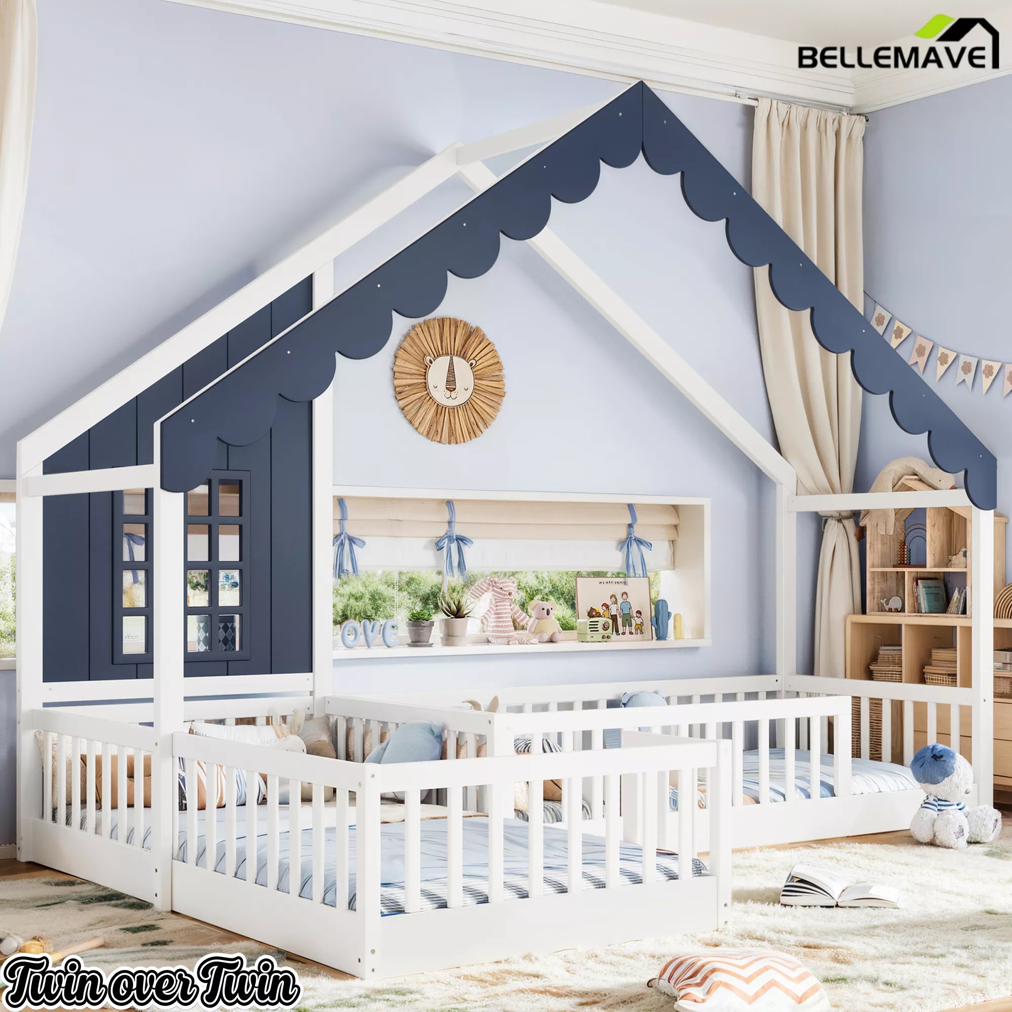 Angled view of a blue and white house-shaped floor bed with guardrails in a kids' bedroom