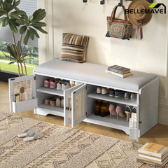 White storage bench with woven rattan doors and cushion