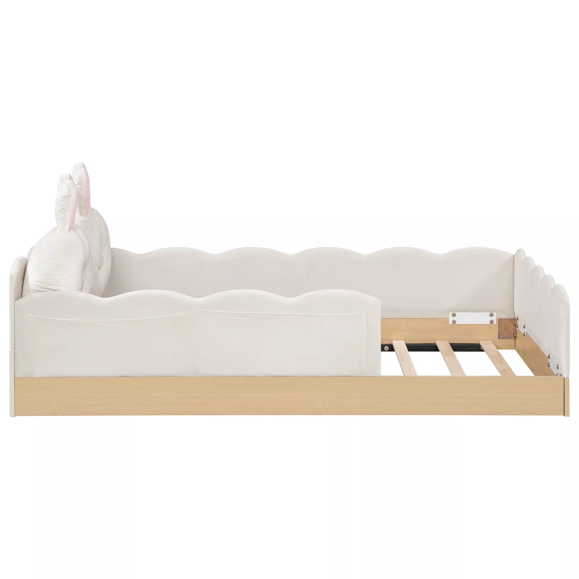 Side profile of white upholstered platform bed with scalloped panels