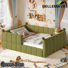 Green upholstered queen floor bed viewed from an angled side perspective