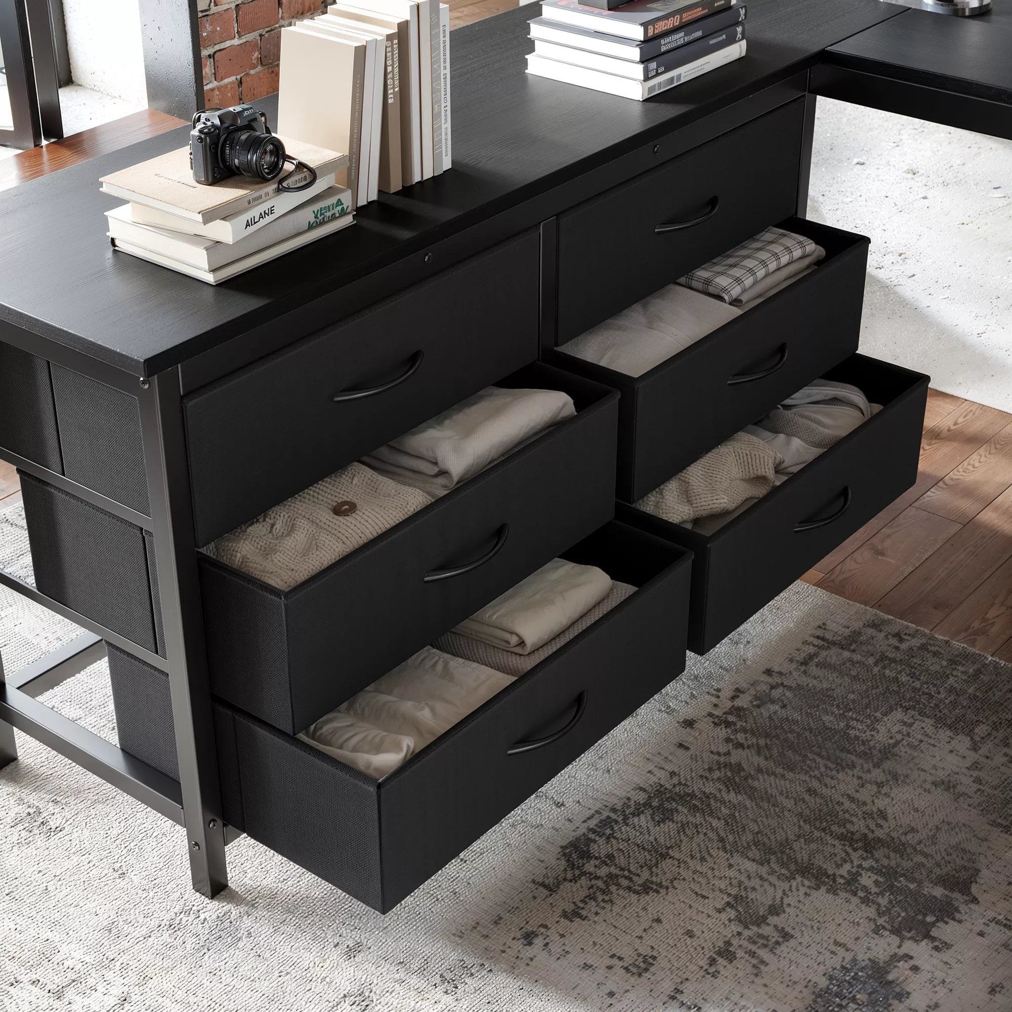 Close-up of the loft bed's pull-out fabric storage drawers beneath the desk
