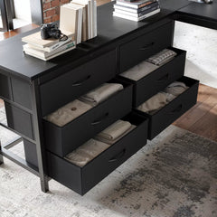 Close-up of the loft bed's pull-out fabric storage drawers beneath the desk