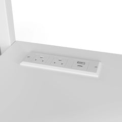 Close-up of the power panel integrated into the metal loft bed desk