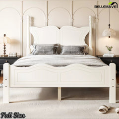 Full size white platform bed with curved butterfly headboard in a bedroom