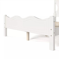 Close-up of the matching curved footboard design on a white platform bed
