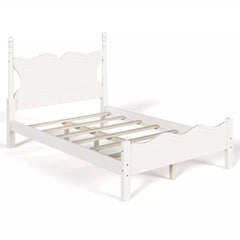 Angled view of a white platform bed frame showing its slatted support base