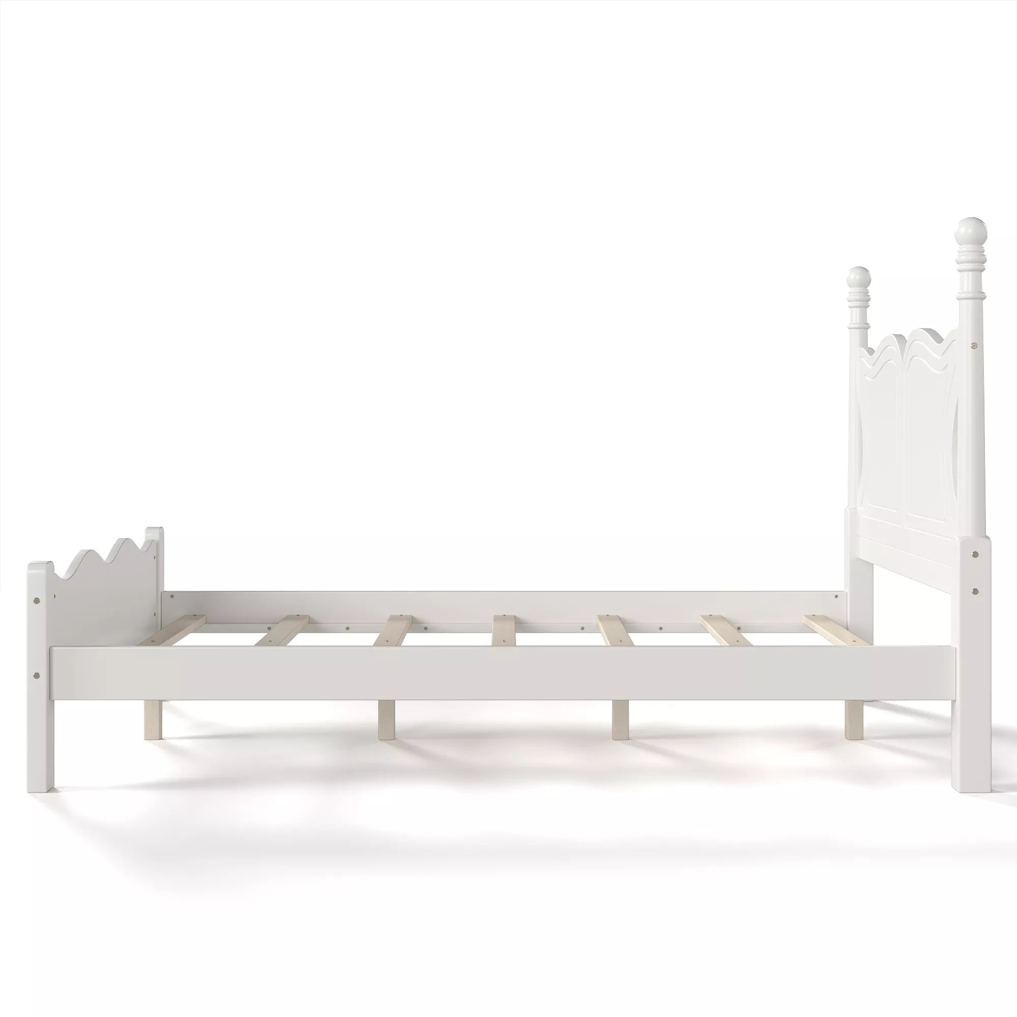 Side view of a white platform bed with matching curved footboard