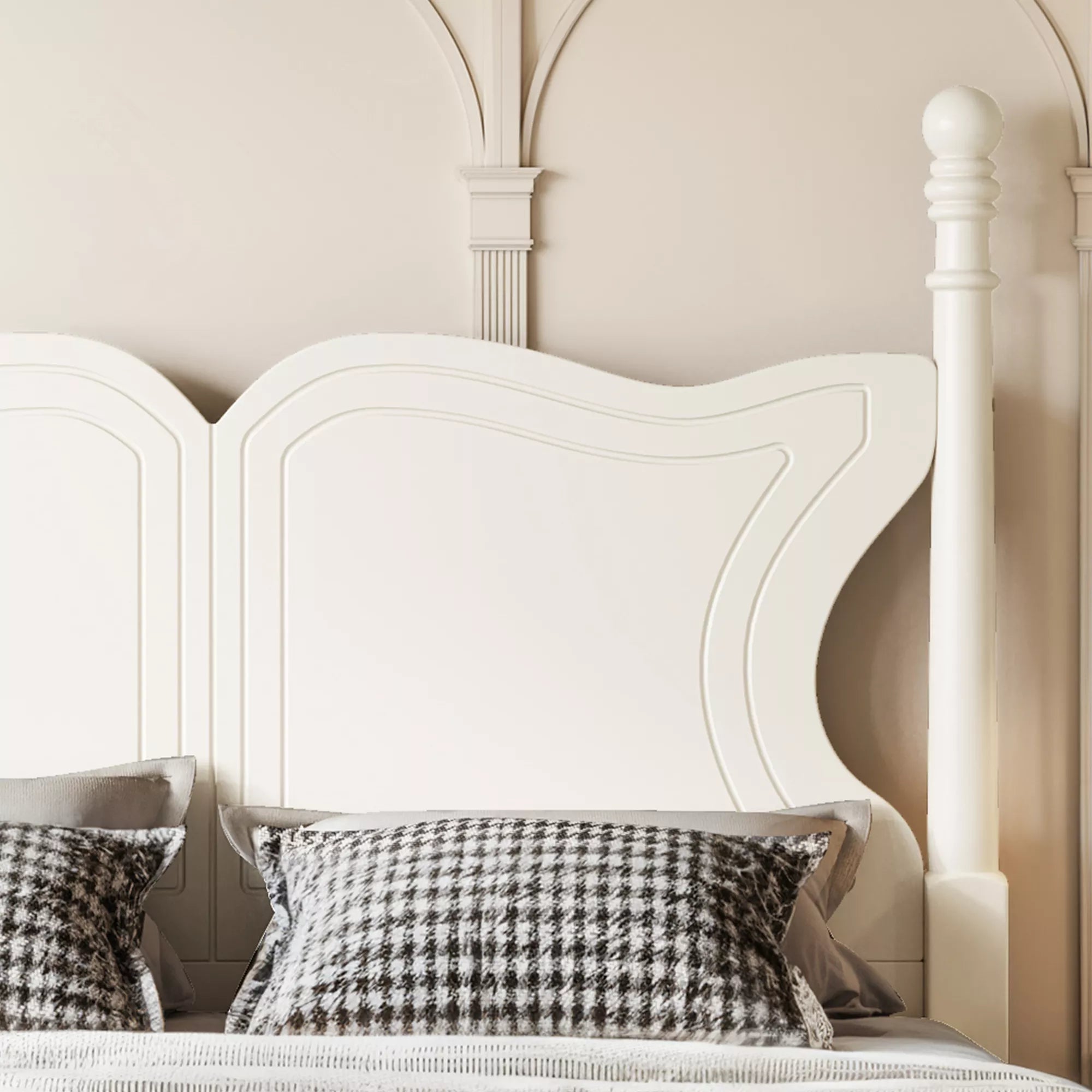 Close-up of the butterfly headboard with pillows on a white bed