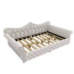 Queen size upholstered daybed with diamond tufting and rolled arms, angled view