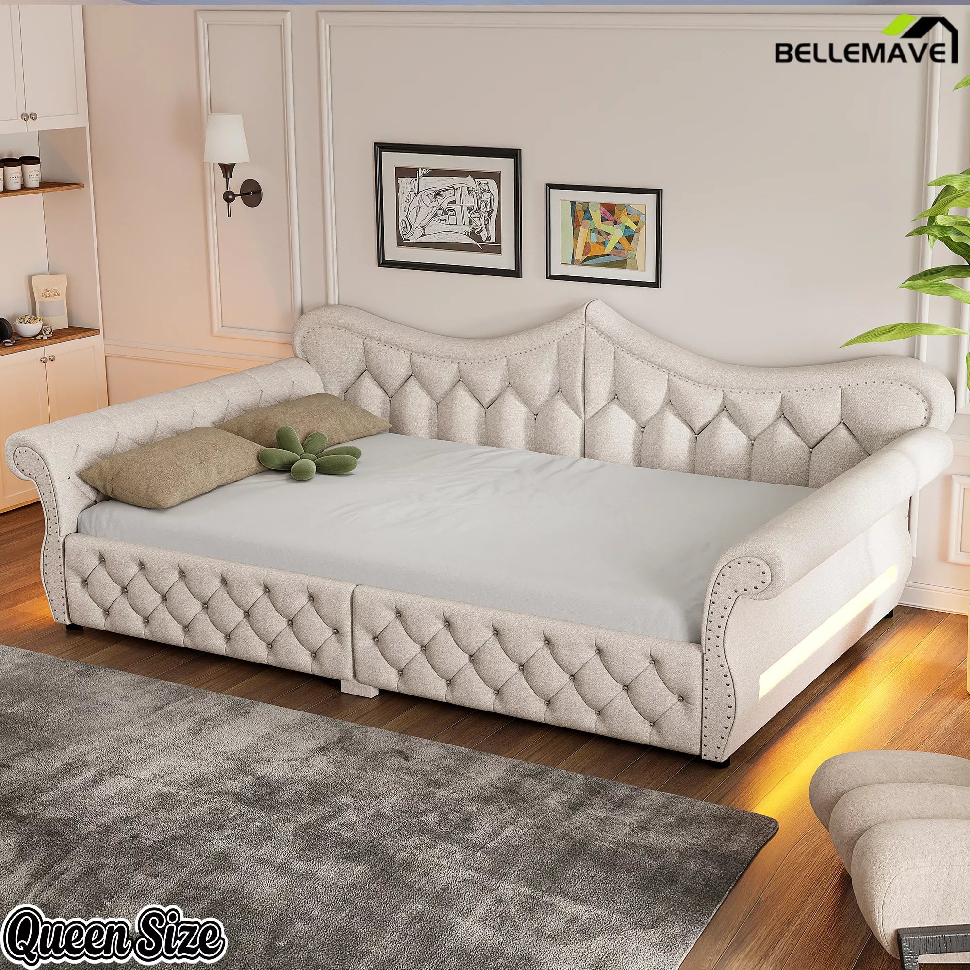 Cream upholstered daybed with tufted backrest and matching side arms