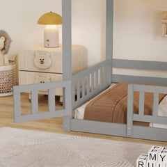 Close-up of gray bunk bed guardrails and lower bunk in a bedroom