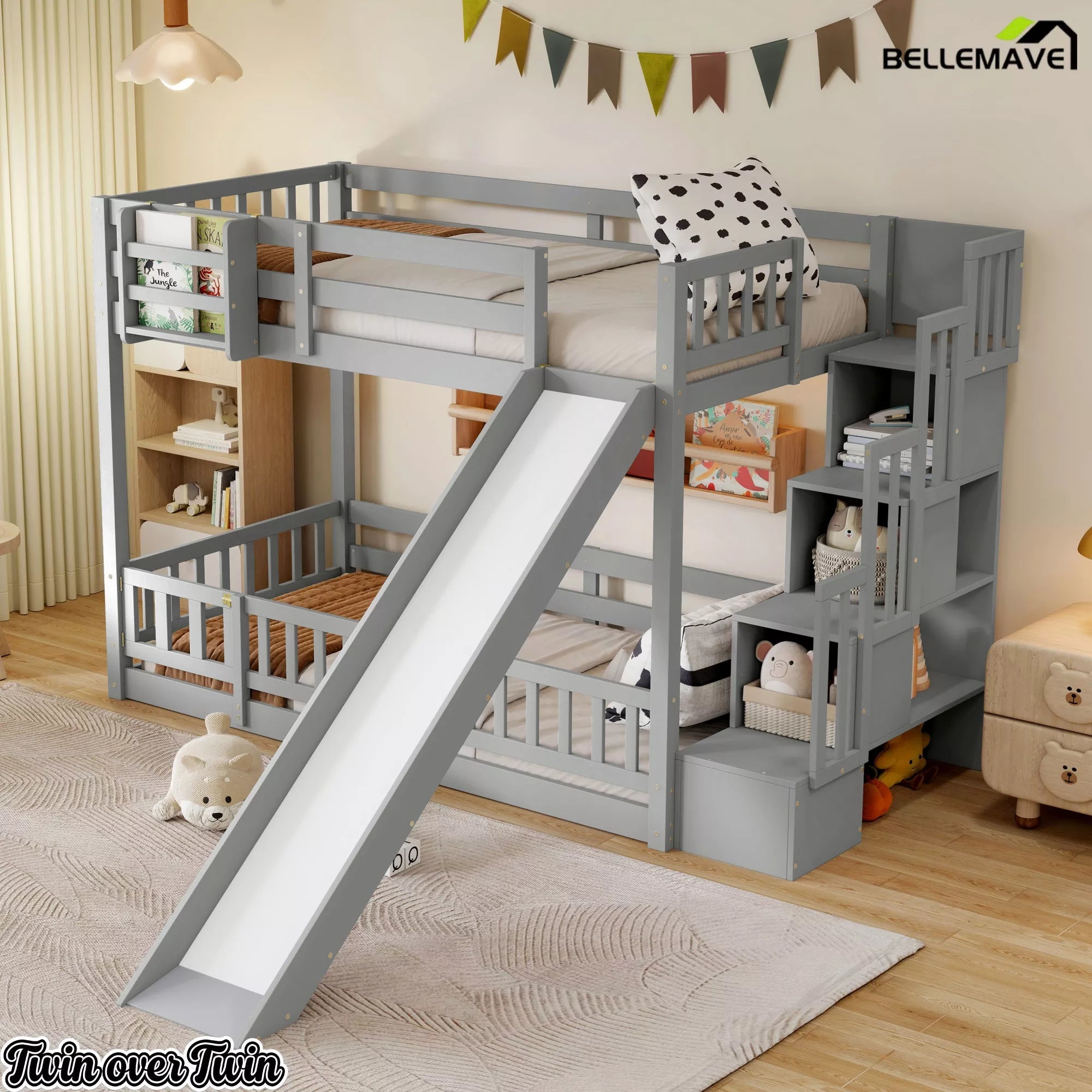 Angled view of gray twin over twin bunk bed with slide and storage staircase