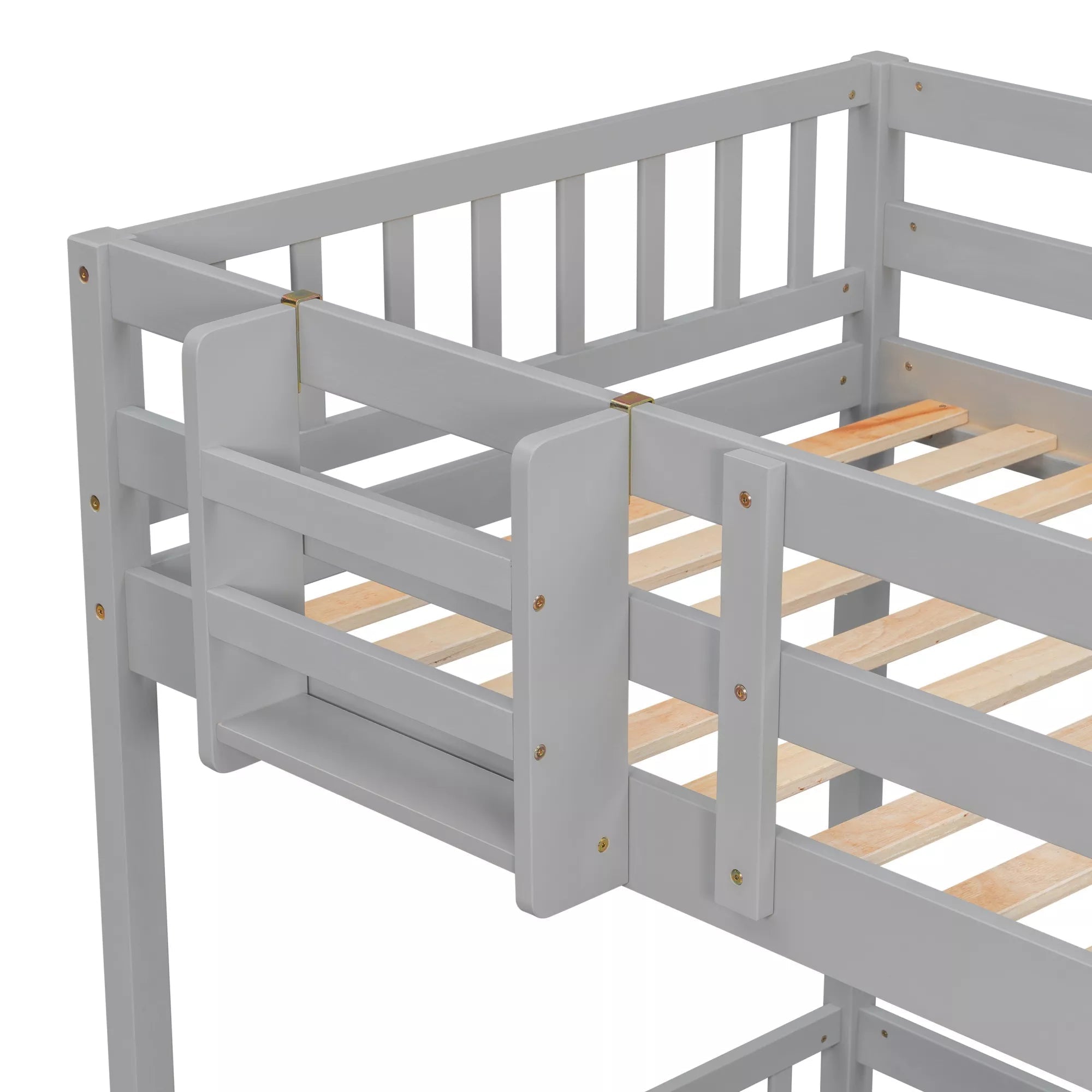 Close-up of upper bunk guardrails and corner posts on a gray twin over twin bunk bed