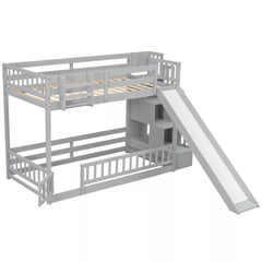 Front angled view of gray twin over twin bunk bed with slide and storage staircase