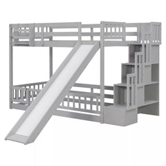 Angled front view of gray twin over twin bunk bed with slide and built-in storage stairs