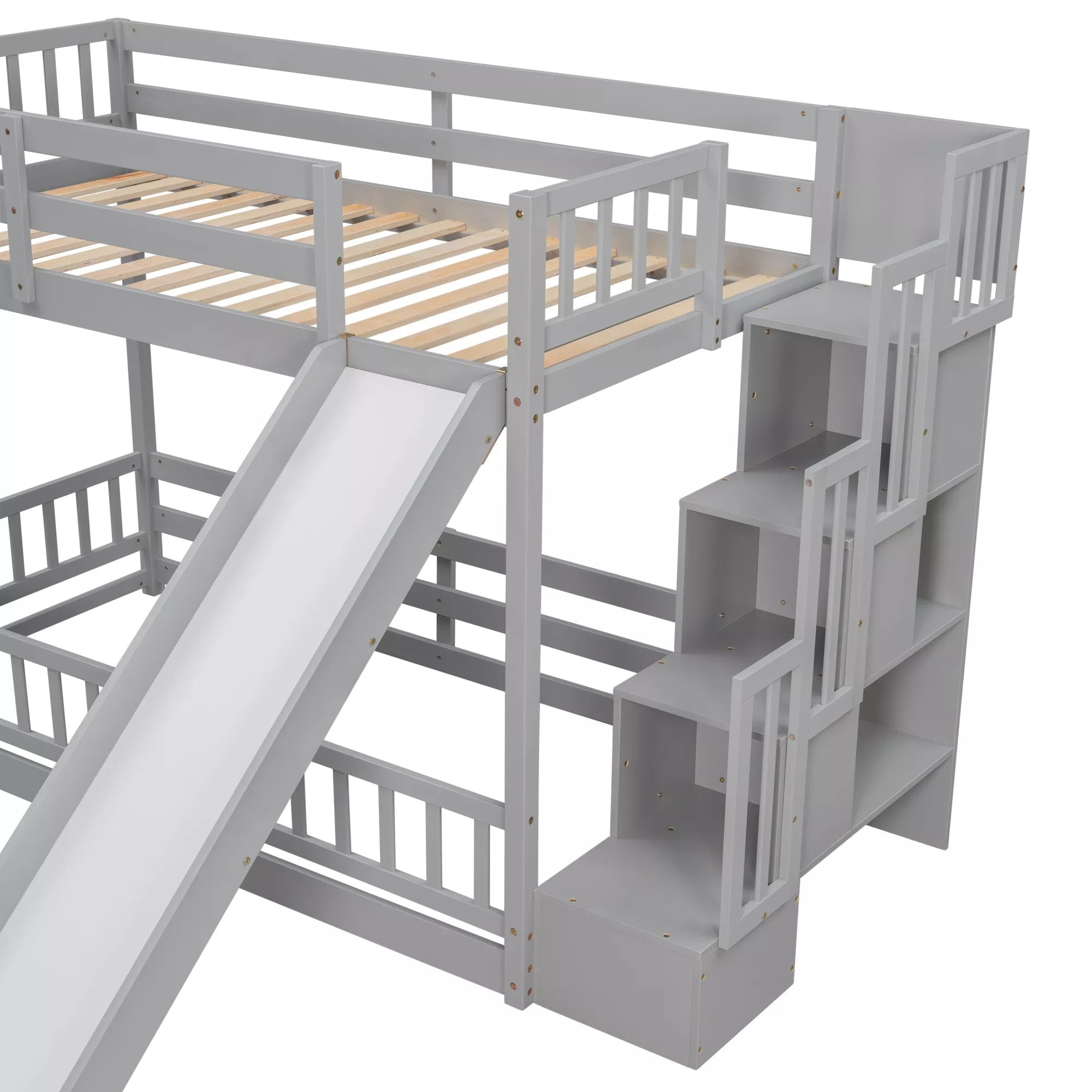 Angled view of gray twin over twin bunk bed with slide, wooden slats and storage stairs